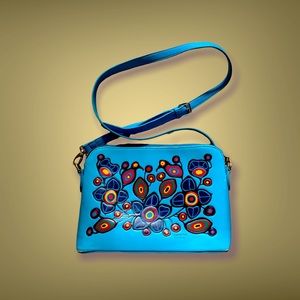 Norval Morrisseau turquoise purse . Colourful native print .